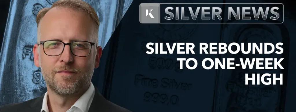 Frank Watson in front of silver news background