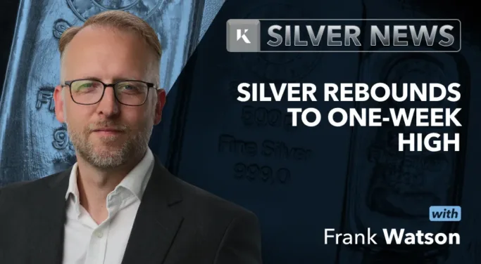 Frank Watson in front of silver news background