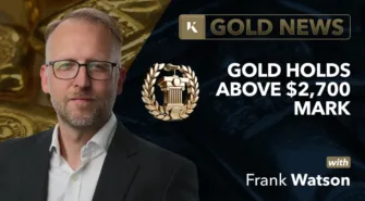 frank watson analyst in front of gold bar background