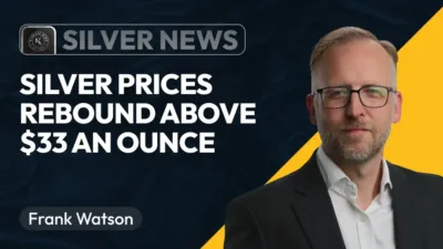 Frank Watson headshot in front of black and gold background.