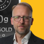 Frank Watson headshot with Kinesis silver bullion bar
